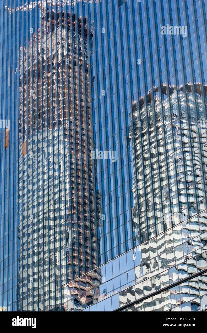 reflection-of-two-buildings-on-a-glass-b