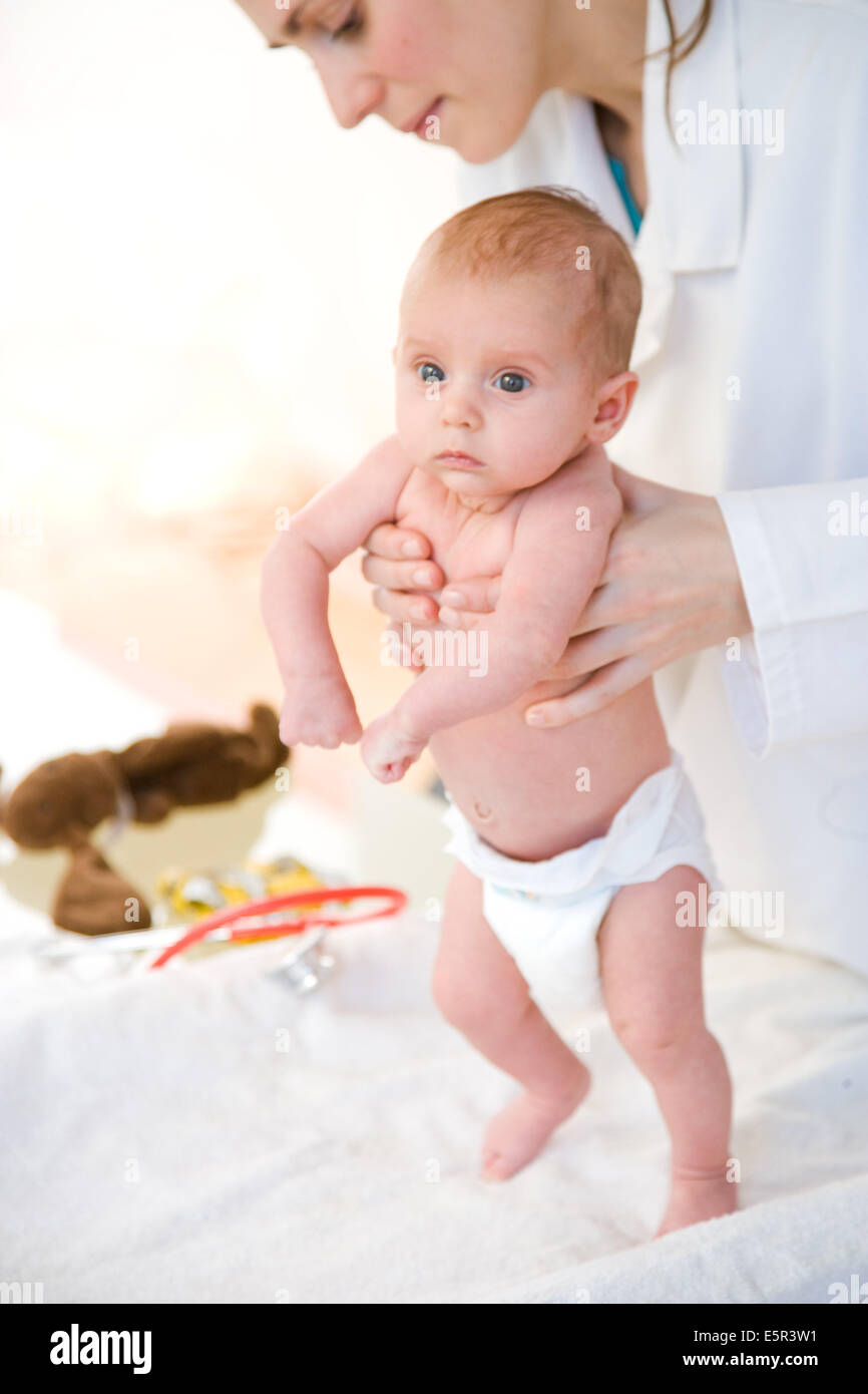 2 month old baby medical examination. The pediatrician is holding the