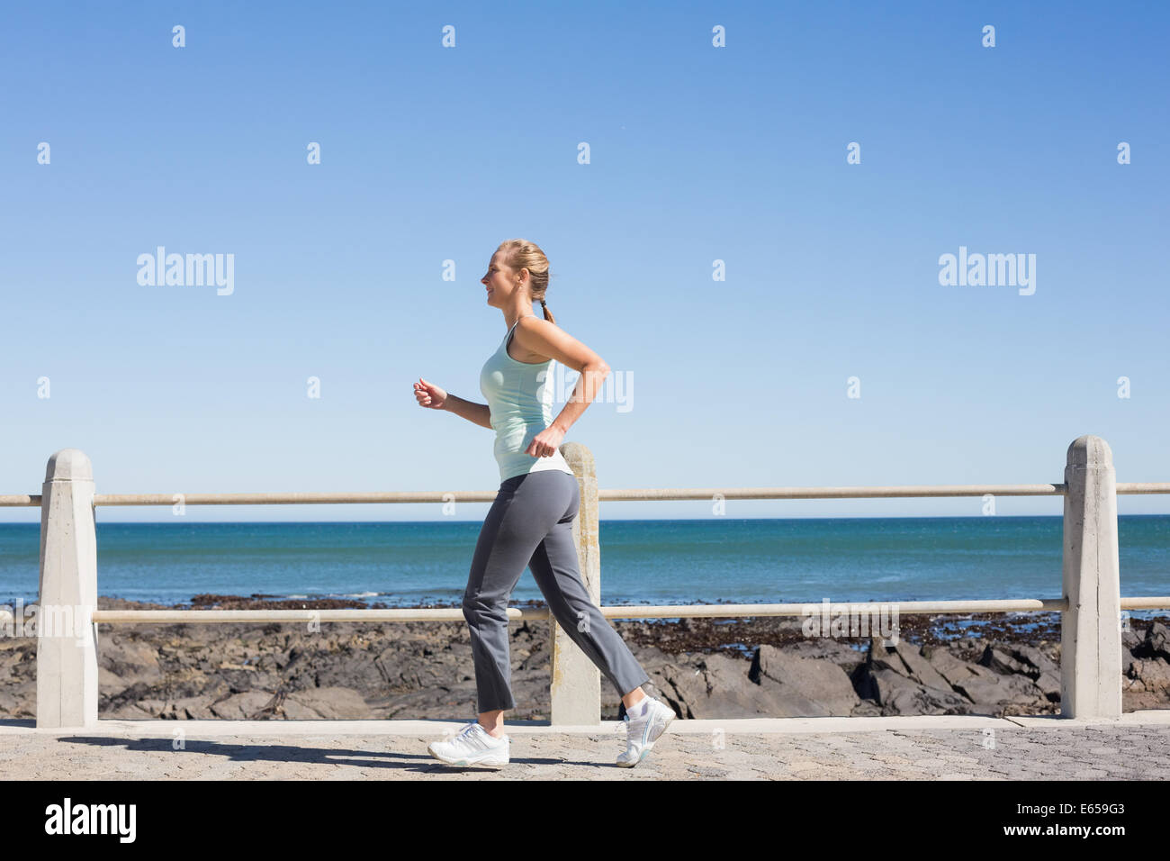 Fit Mature Woman Jogging On The Pier Stock Photo Alamy