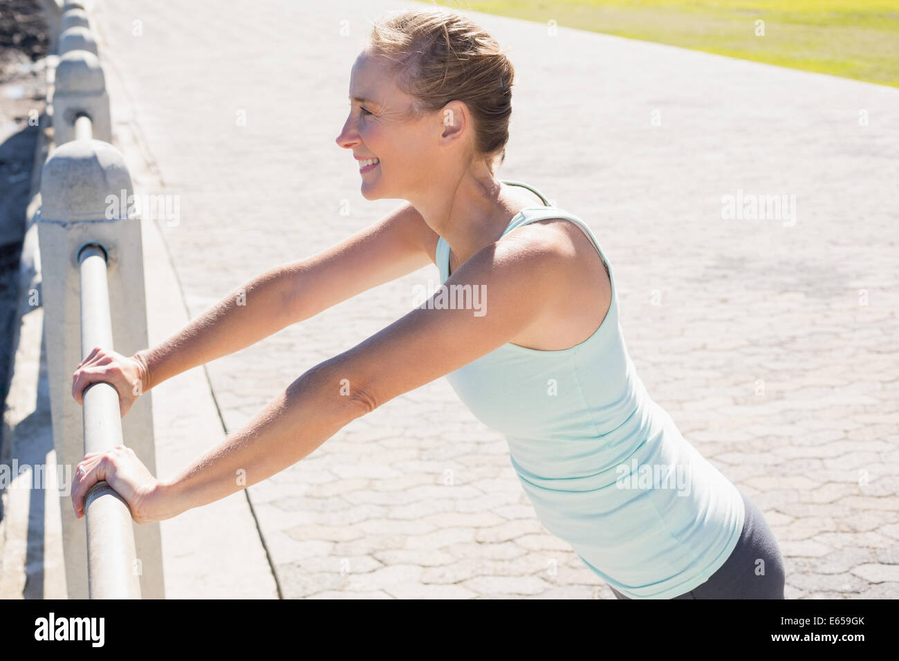 Fit Mature Woman Warming Up On The Pier Stock Photo Alamy