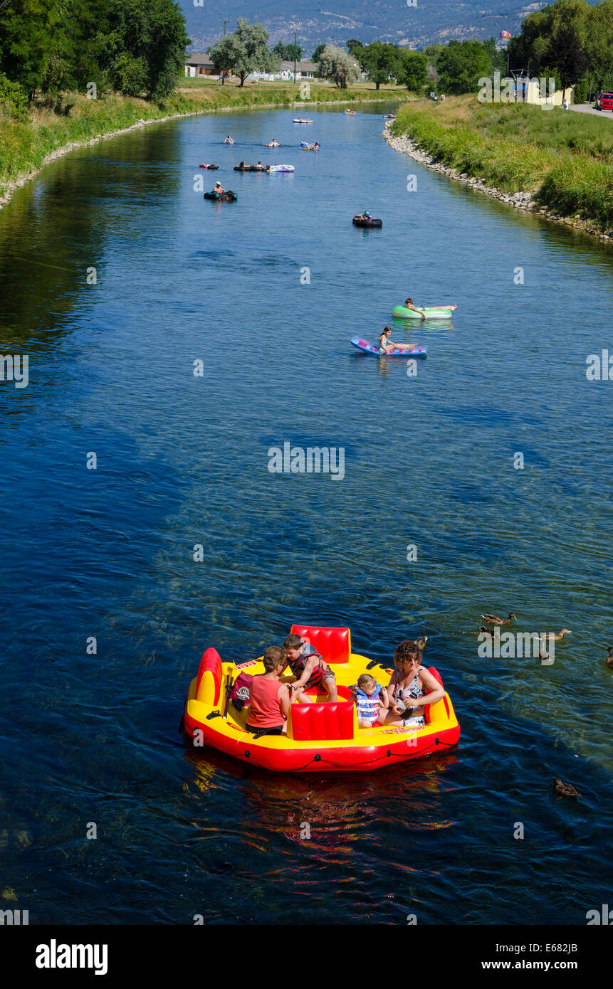 Inner tubing rafting floating on the Penticton River, Penticton, BC