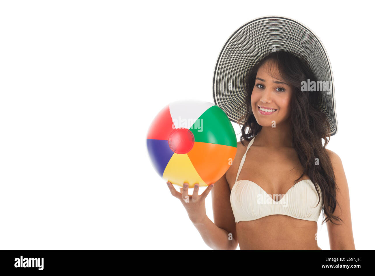 Black Woman In Bikini Playing With Colorful Beach Ball Isolated Over