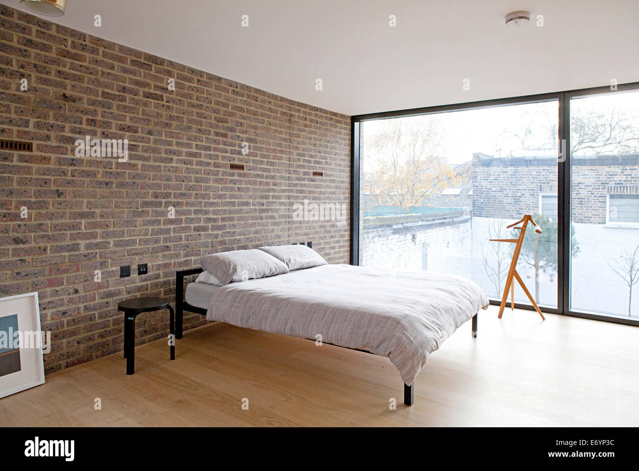 bedroom with exposed brick wall in duggan morris house, kings bedroom with exposed brick wall in duggan morris house, kings