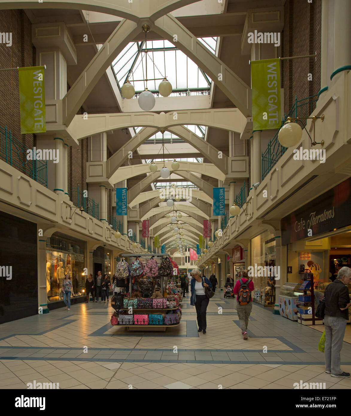 Interior Of Modern Shopping Mall With Glass Ceiling And People - Interior Of Modern Shopping Mall With Glass Ceiling And People Passing Shopsin Oxford England interior of modern shopping mall with glass ceiling and people - interior of modern shopping mall with glass ceiling and people passing shopsin oxford england
