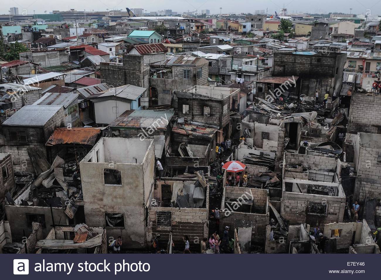 Manila, Philippines. 16th Sept, 2014. Residents salvage belongings