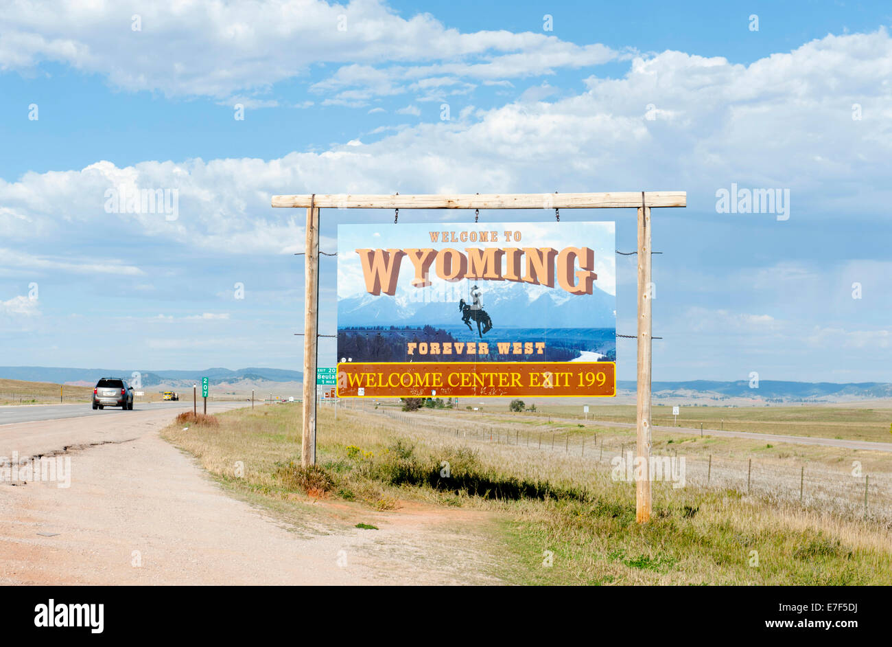 sign on a highway, to Wyoming, Forever West", flat