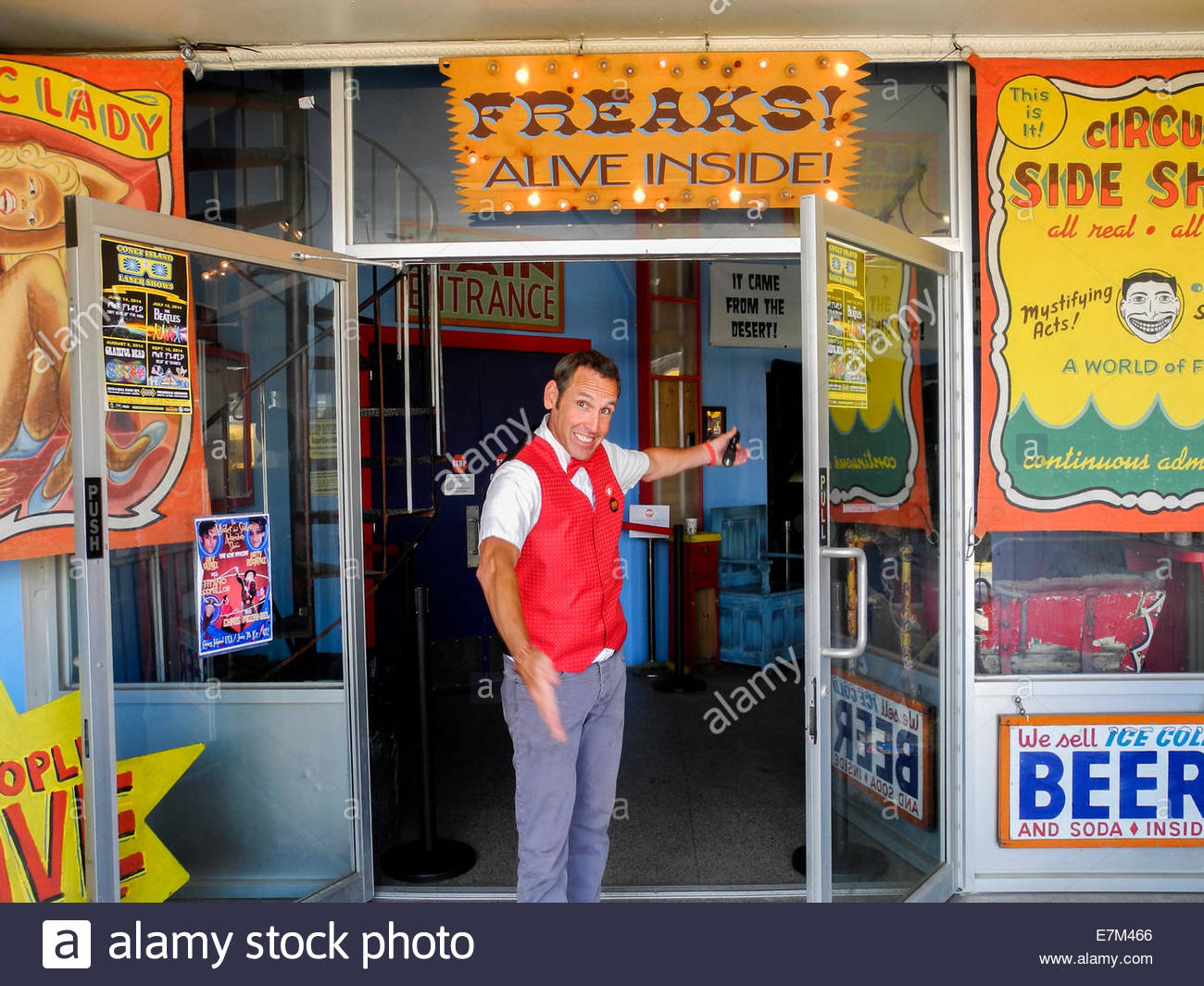 a-barker-in-a-red-vest-at-coney-island-n