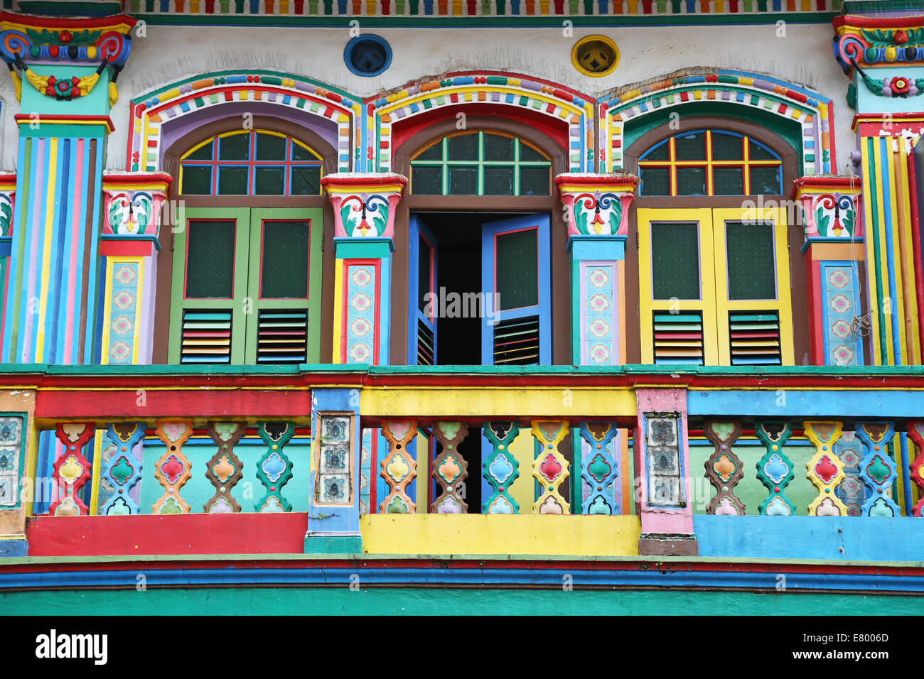 Traditional rainbow coloured house with colourful windows and shutters in little india in singapore republic