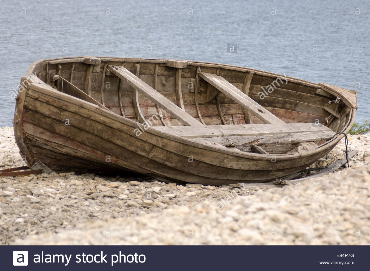 Old broken wooden boat on a beach Stock Photo, Royalty ...