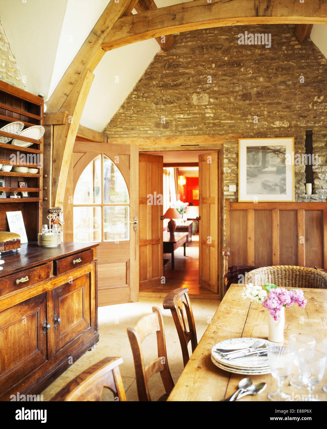 Uncategorized Exposed Wooden Beams exposed stone wall and large wooden beams in barn conversion dining room with antique dresser pine table
