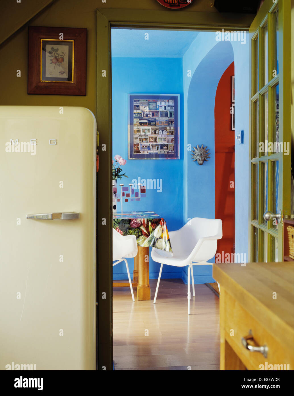 Kitchen with large cream Smeg refrigerator beside doorway to blue ... Kitchen with large cream Smeg refrigerator beside doorway to blue ...