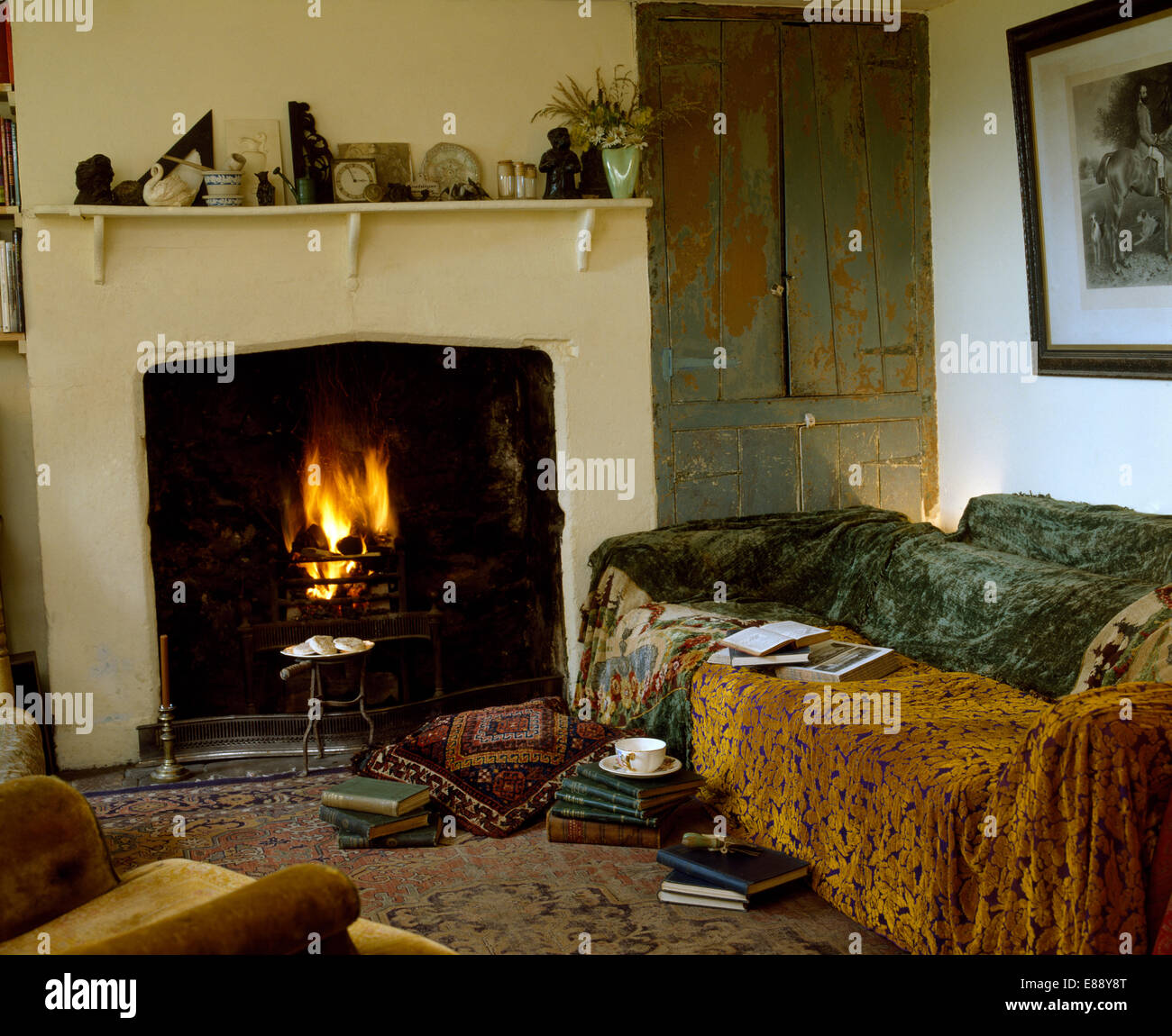 Cottage Living Room With Fireplace brown and grey velvet throws on sofa beside fireplace in economy Cottage Living Room With Fireplace brown and grey velvet throws on sofa beside fireplace in economy
