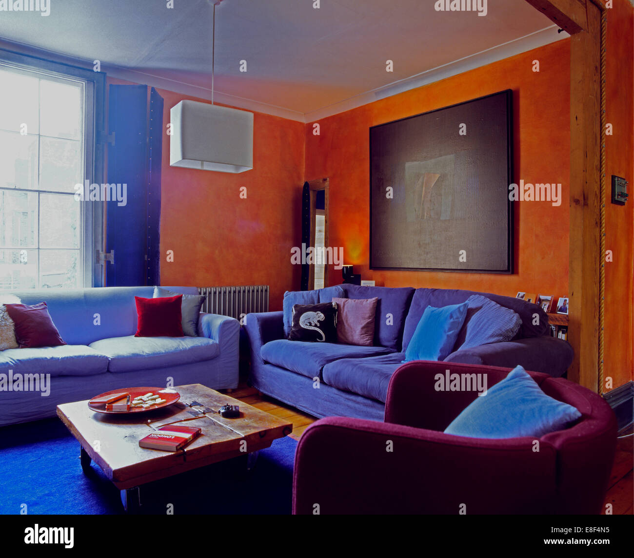 Blue Velvet Sofas And Purple Armchair In Nineties Orange Living