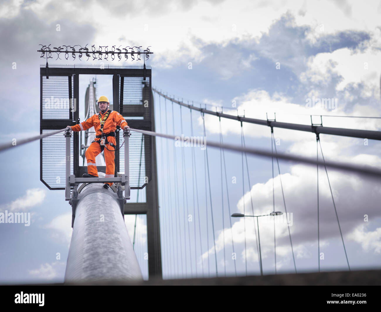 Bridge worker on cable of suspension bridge Humber Bridge UK was Stock