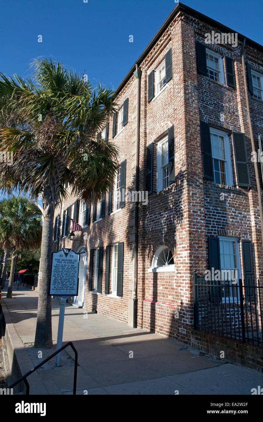 Brick building in Charleston, SC. with historical marker for the Stock