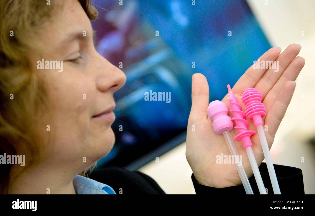Isabelle Thomas, employee of French company Cobiporc, holds fertility aids ...