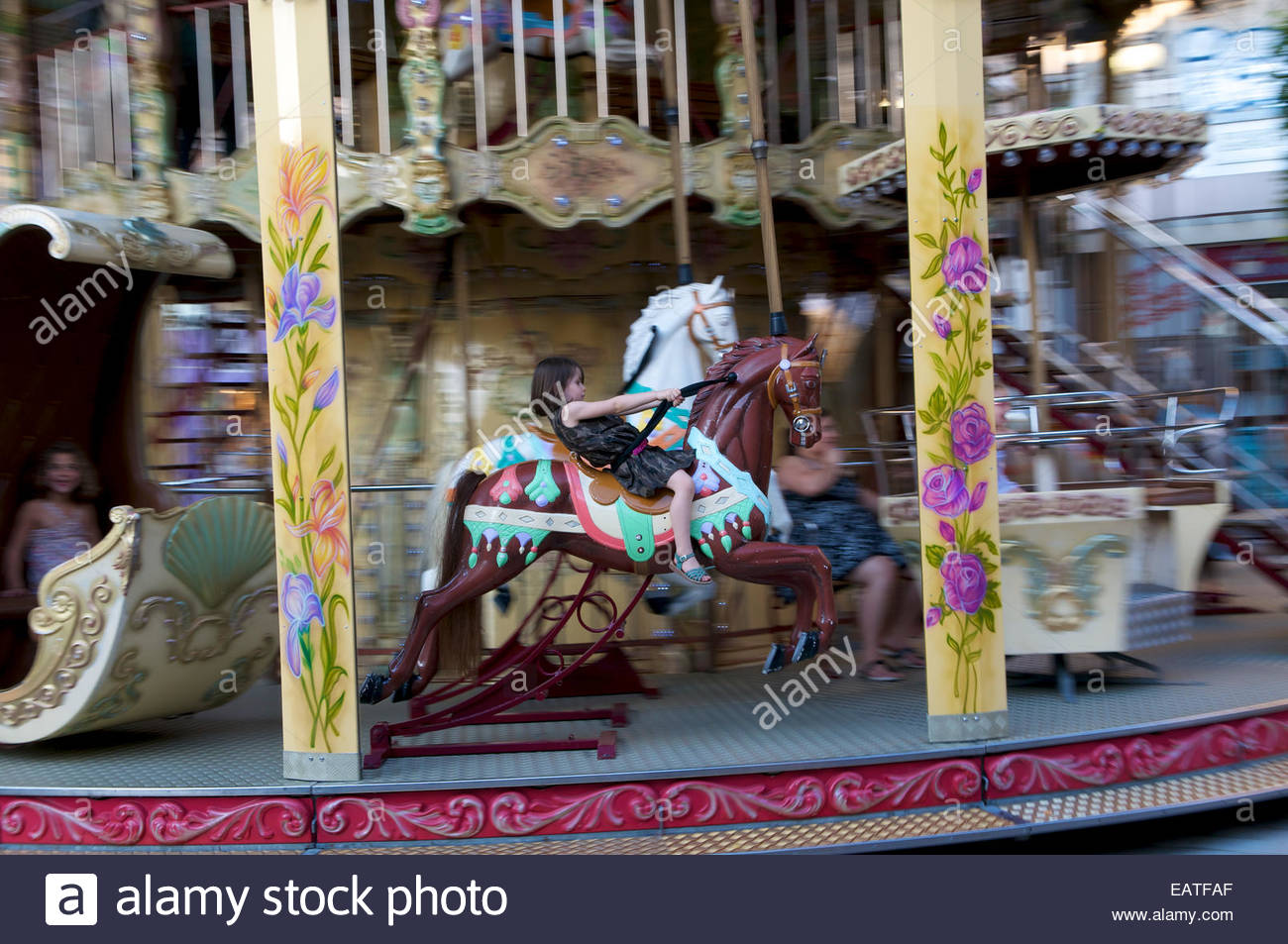 Little girl riding a carousel horse in Reims Stock Photo, Royalty Free Image 75526935 Alamy