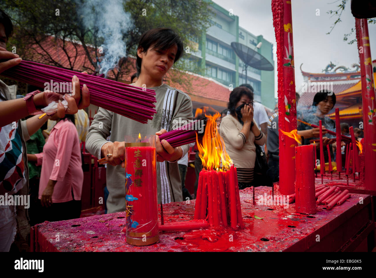 People burn incense sticks during Chinese New Year ritual in Jakarta
