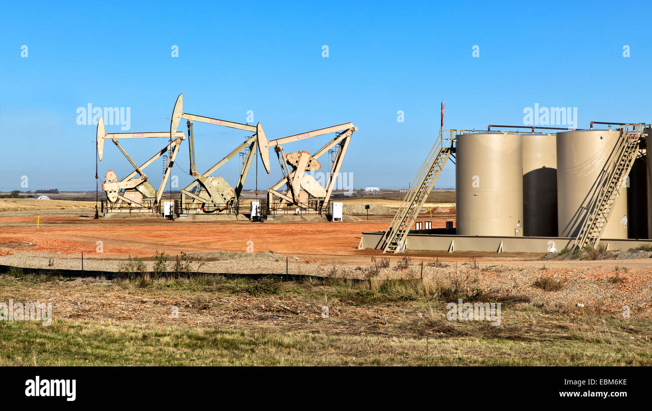 Nodding Donkeys pump crude oil from strata Stock Photo, Royalty Free