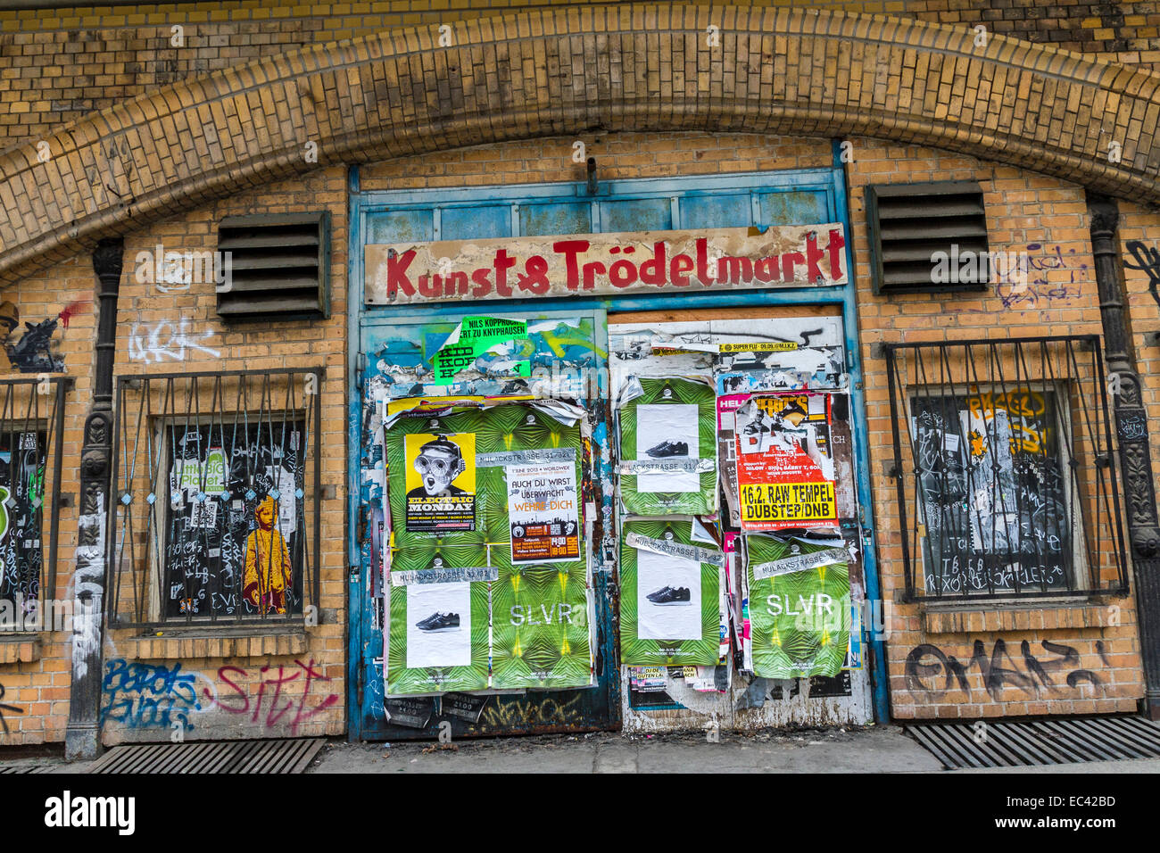 Stock photo with posters and graffiti spotted house wall in the center of berlin