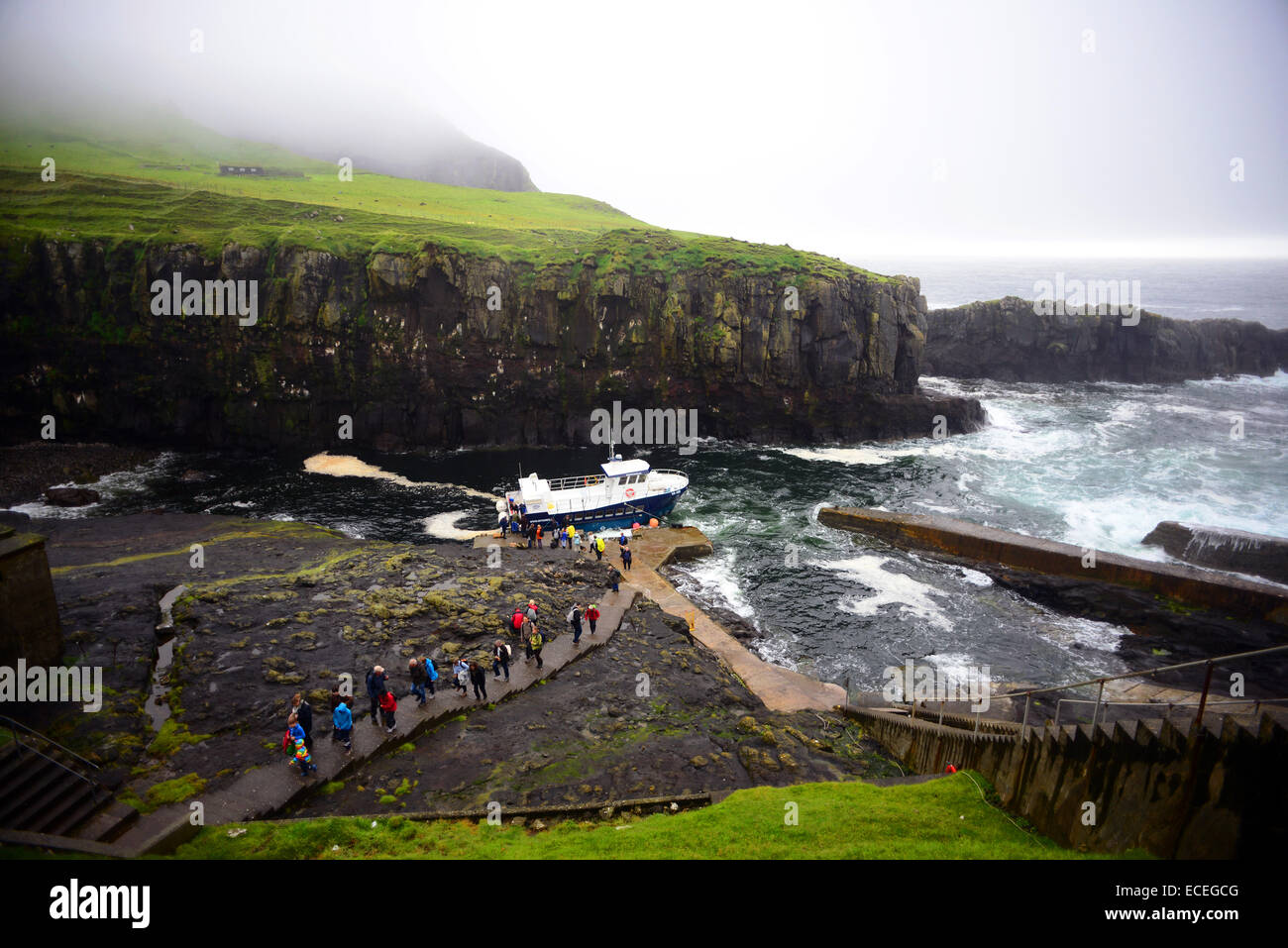 Visitors arrive at Mykines island in ferry called Jósup, Faroe Stock