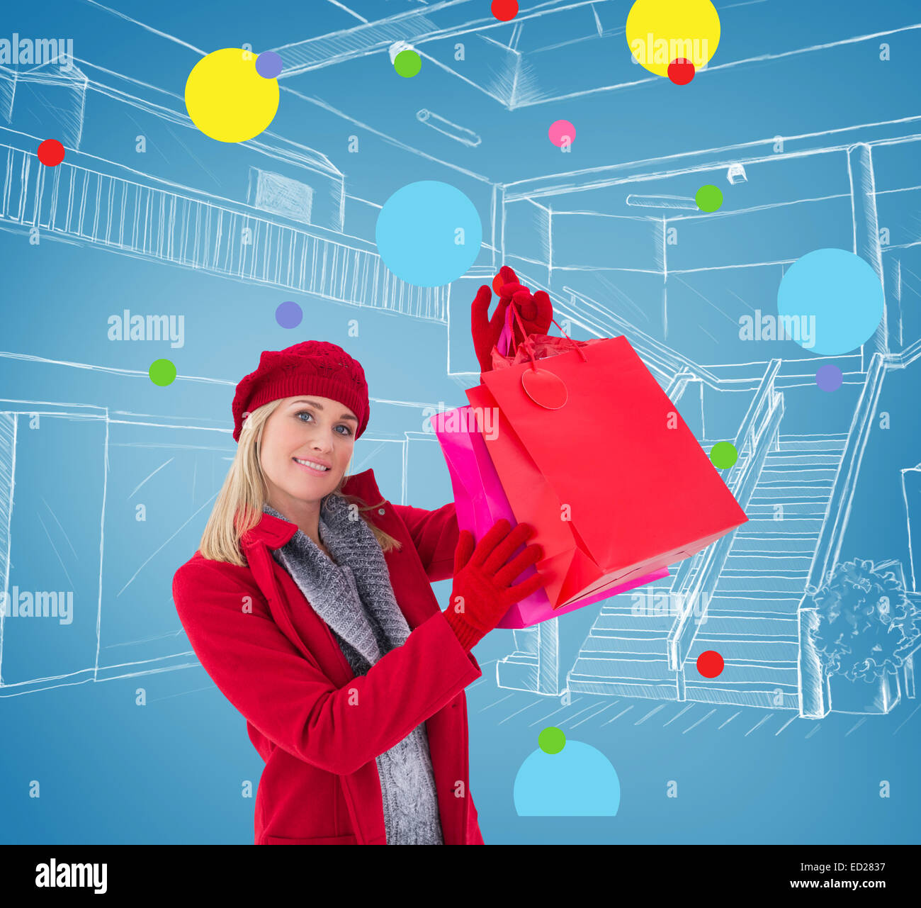 Composite Image Of Blonde In Winter Clothes Holding Shopping Bags Stock