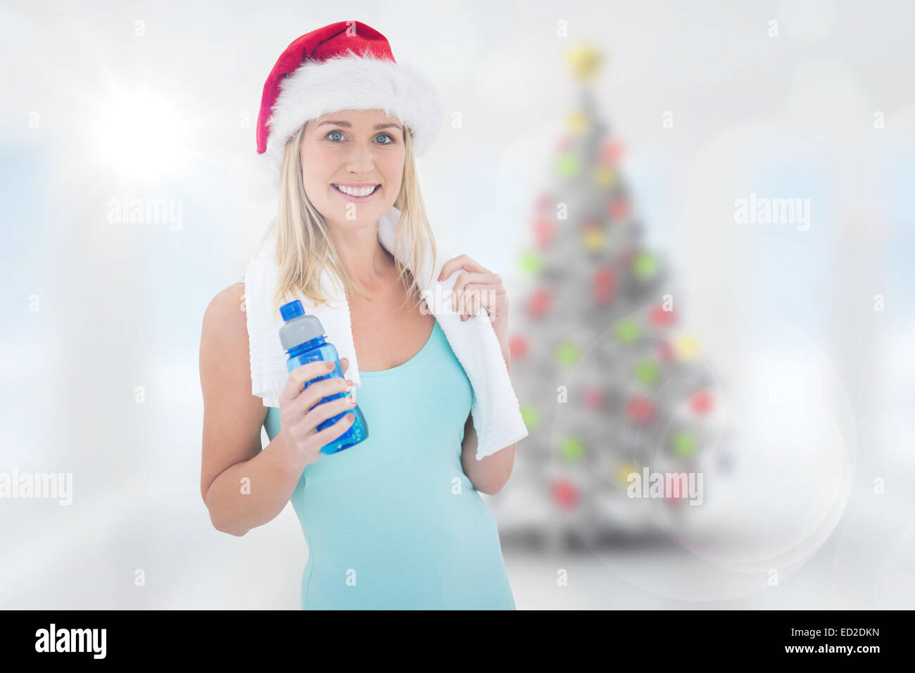 Composite Image Of Festive Fit Blonde Smiling At Camera Stock Photo Alamy