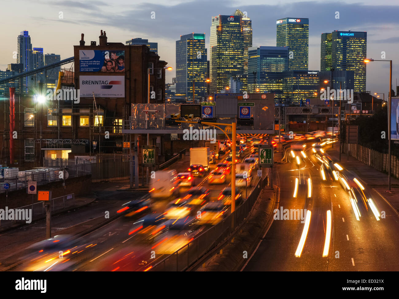 Traffic on A102 Blackwall Tunnel Approach with Canary Wharf Stock Photo