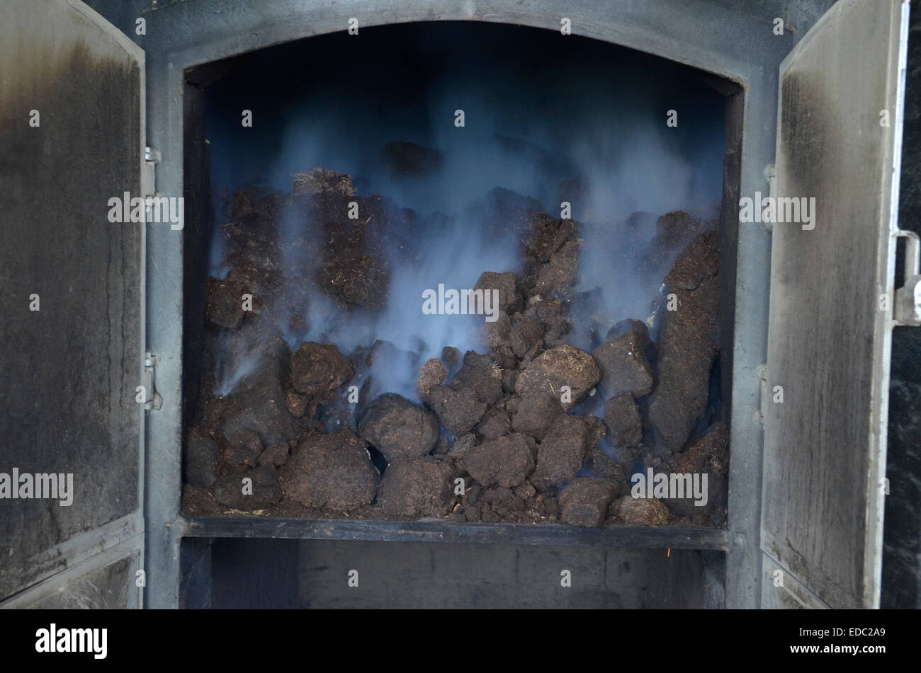 Peat burning at the Laphroaig Whisky Distillery on the island of Stock