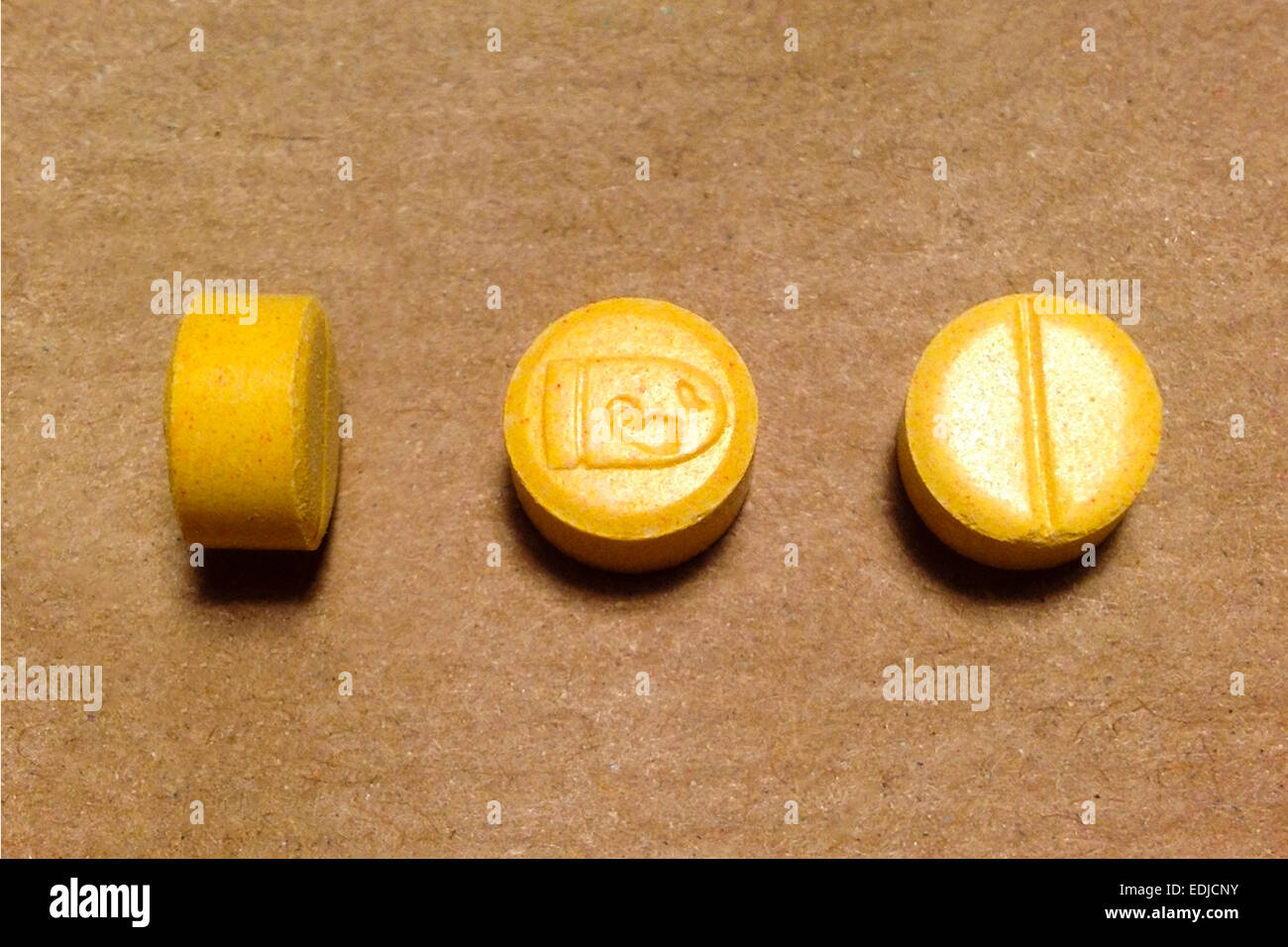What is the long, yellow, oval pill with 200 on one side?