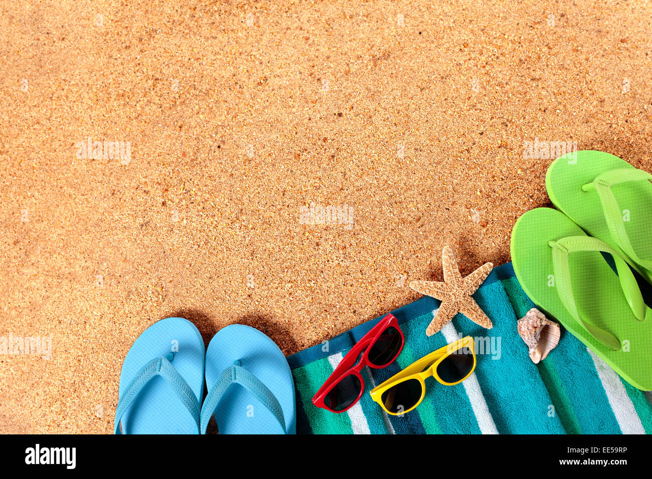 Summer beach background of towel, starfish, seashell, flip 