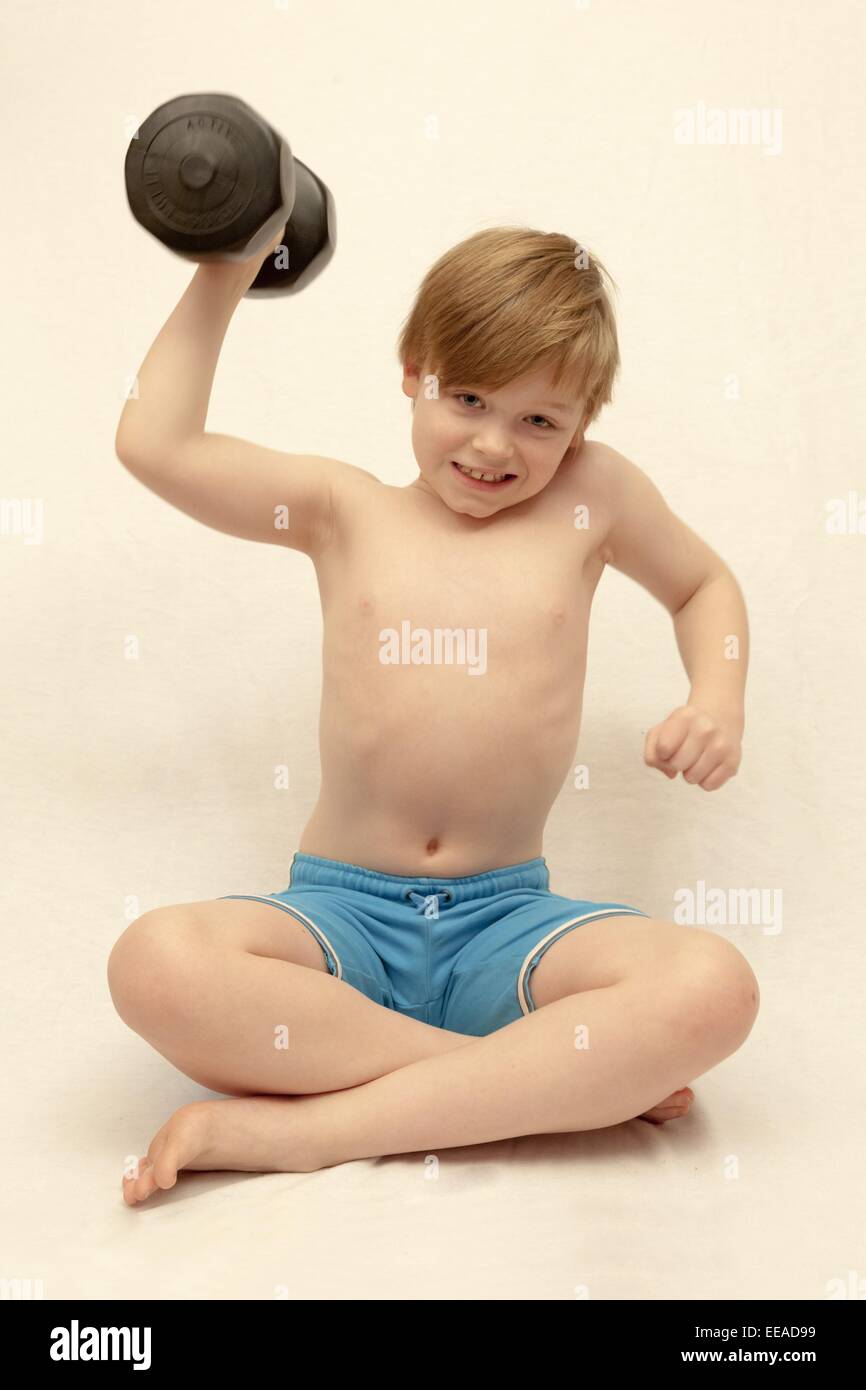 young boy lifting weights Stock Photo, Royalty Free Image 77676629 Alamy