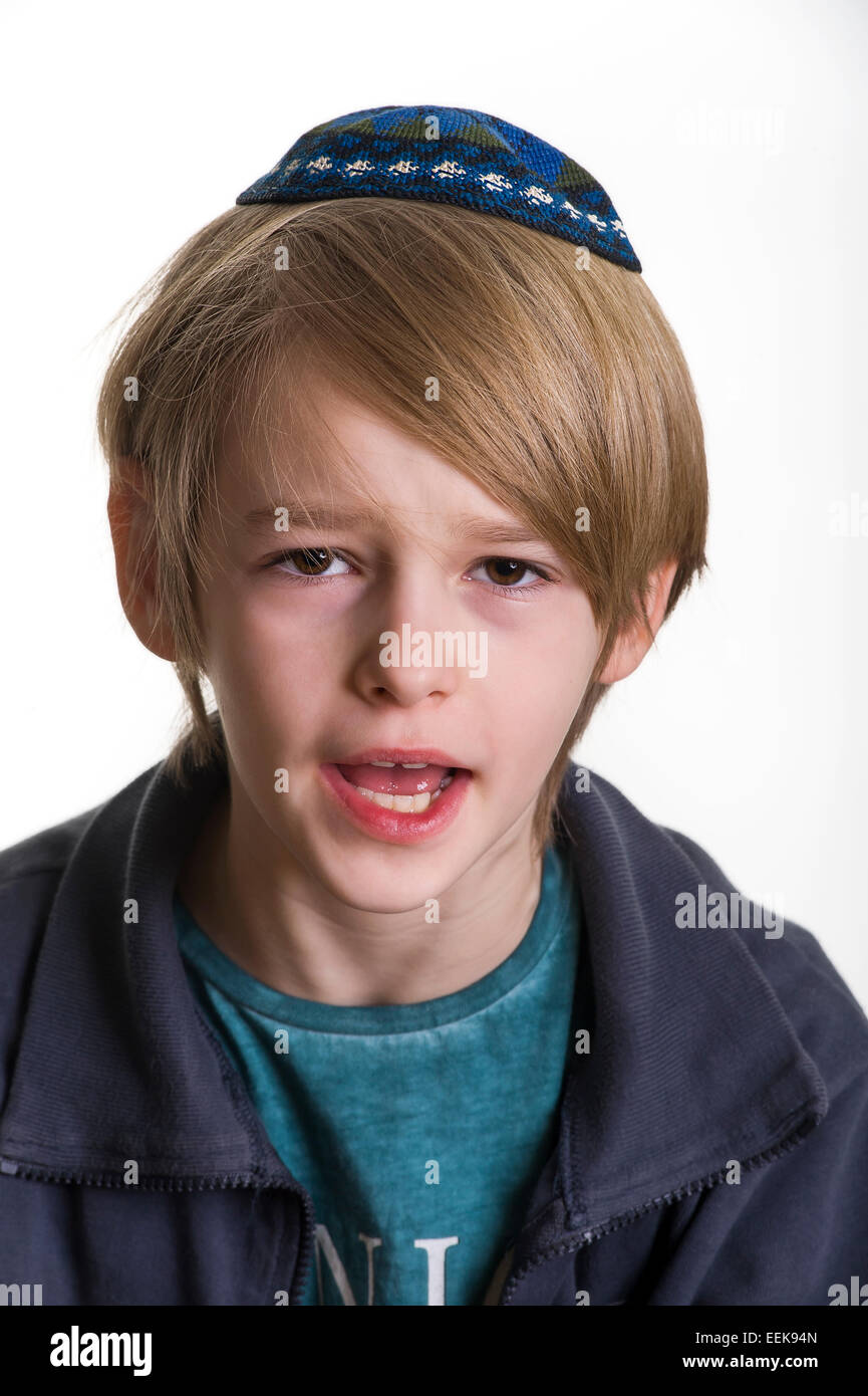 studio portrait of irritated white boy with Jews kipa or yarmulke Stock ...