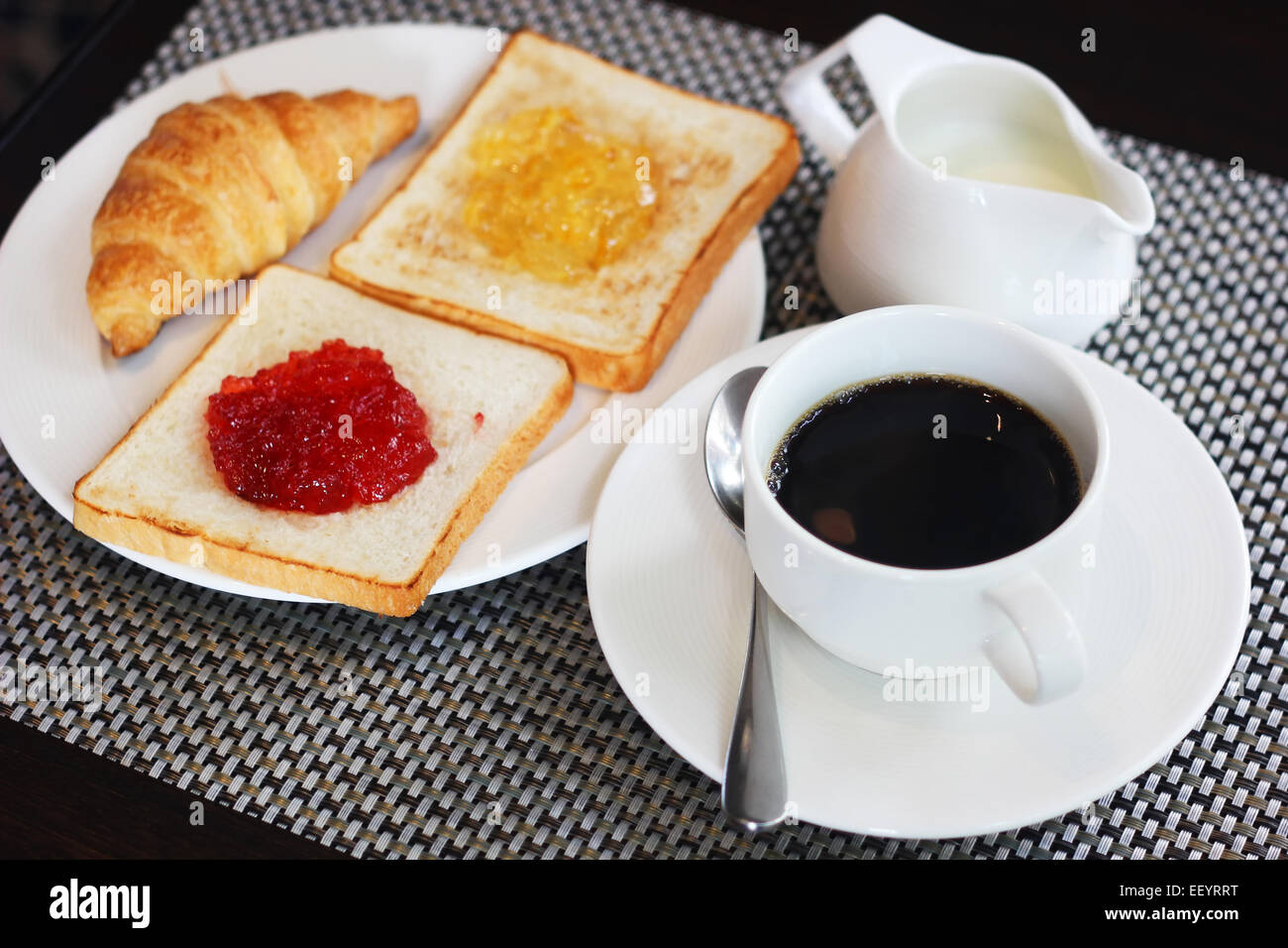Breakfast meal with croissant bread jam and coffee Stock Photo, Royalty