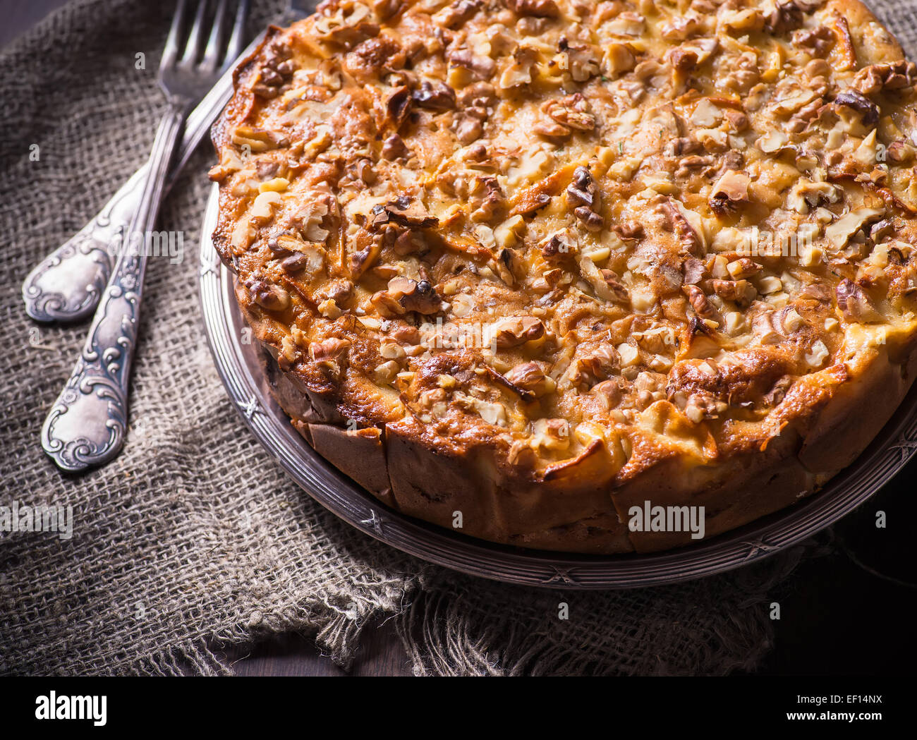 Homemade Apple Pie With Cinnamon And Nuts On Olive Wood Board Rustic Style Selective Focus Homemade Apple Pie With Cinnamon And Nuts On Olive Wood Board Rustic Style Selective Focus