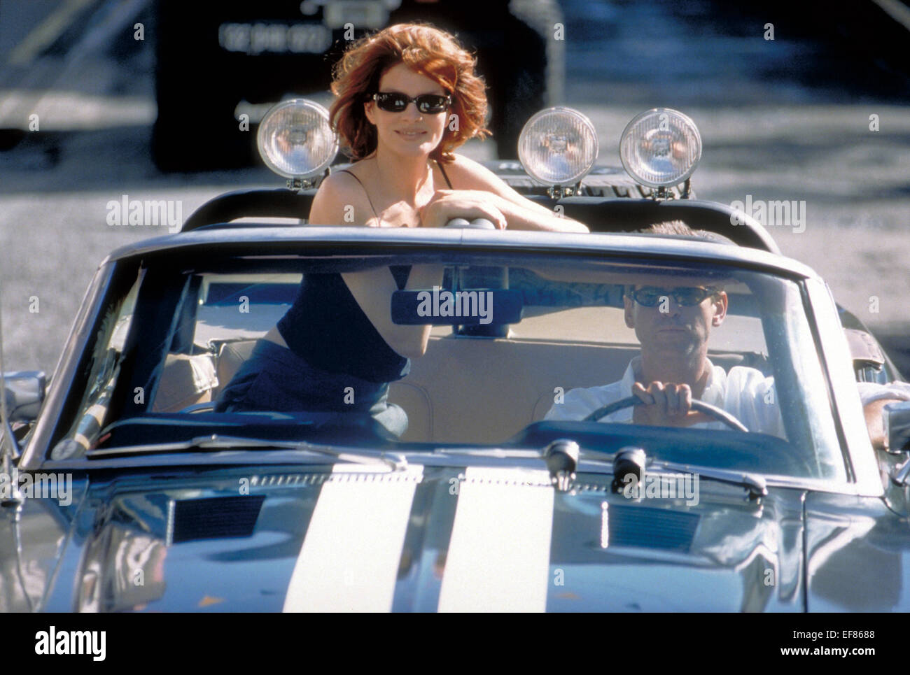 RENE RUSSO & PIERCE BROSNAN THE THOMAS CROWN AFFAIR (1999 Stock Photo