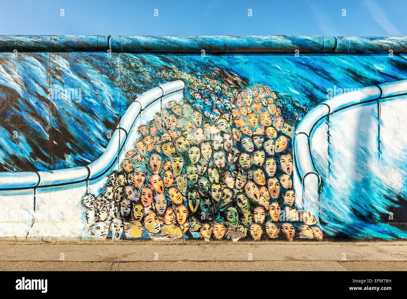 Graffiti art depicting people escaping East Berlin on Berlin wall ...