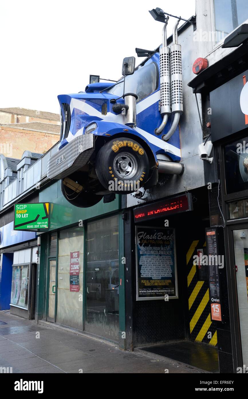 Image of the entrance to "The Garage" which has an Stock