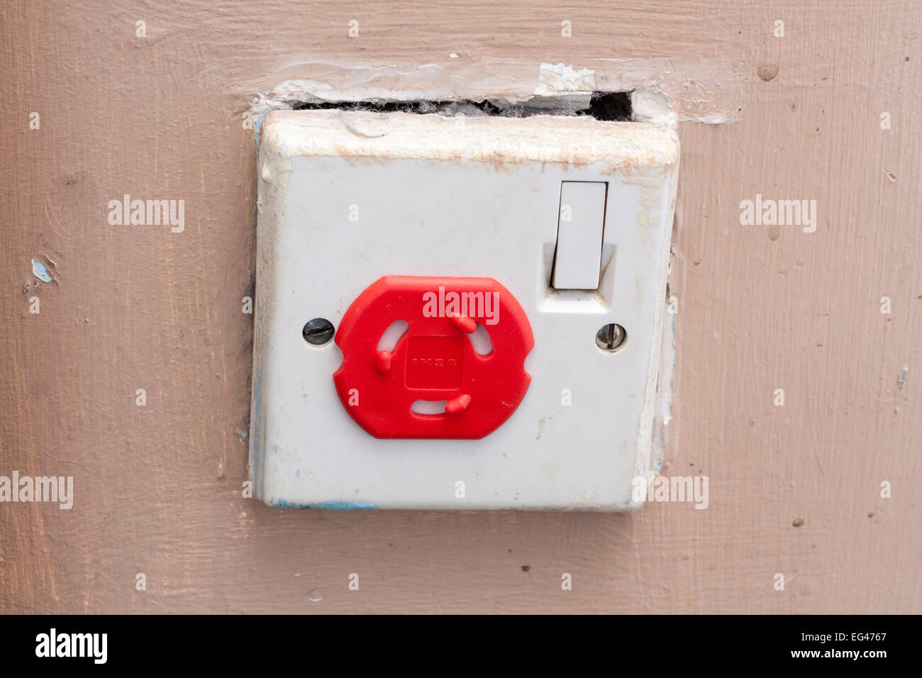 A single British 3pin electrical socket in an unsafe condition with Stock Photo, Royalty Free