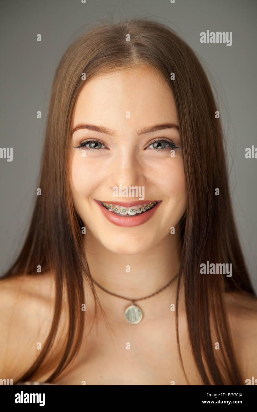 Portrait of a pretty fifteen year old girl wearing braces Stock Photo, Royalty Free Image