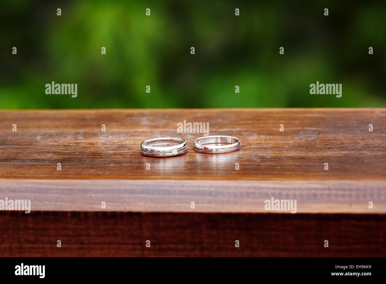 Wedding Engagement Rings Close Up On Wood Background Rustic Style Decoration Wedding Engagement Rings Close Up On Wood Background Rustic Style Decoration
