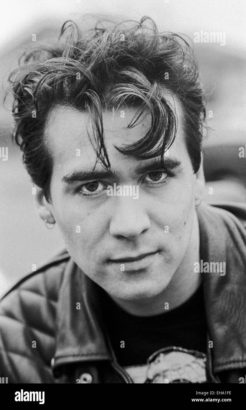 Phil Oakey of the Human League poses to camera dressed in a leather