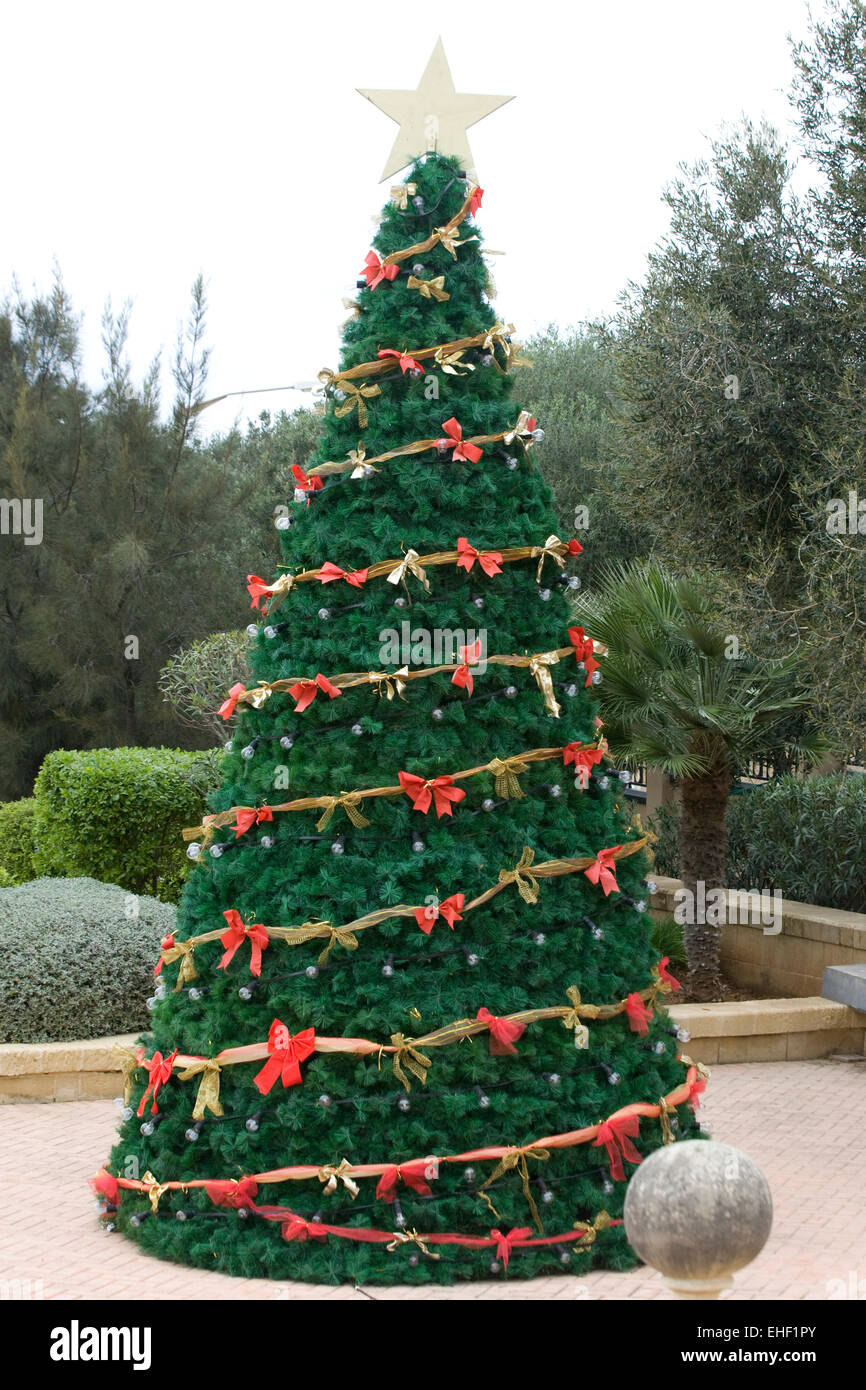 Real Christmas Tree Decorated with Red Bows and fairy 