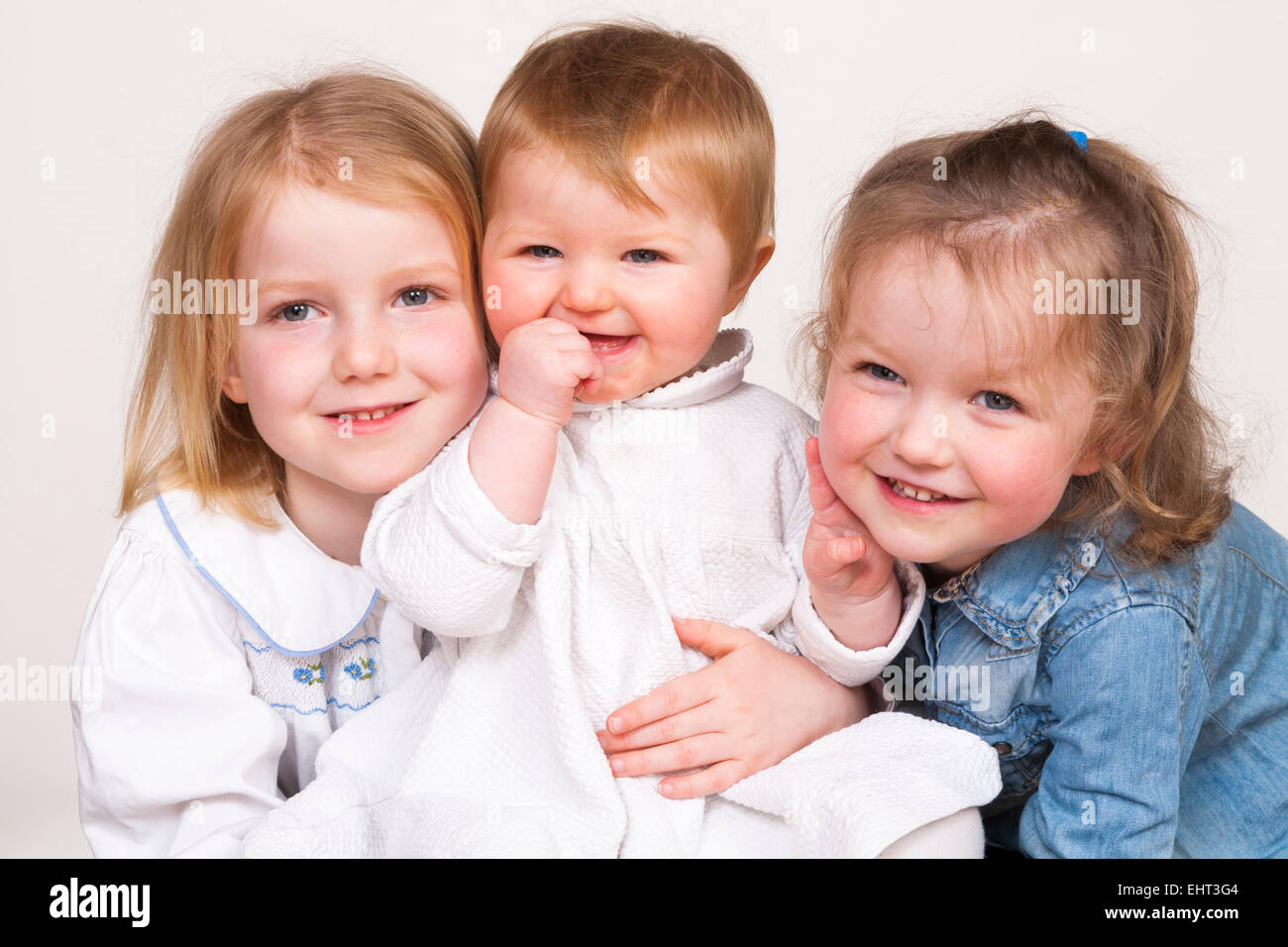 family-group-portrait-of-3-three-young-c