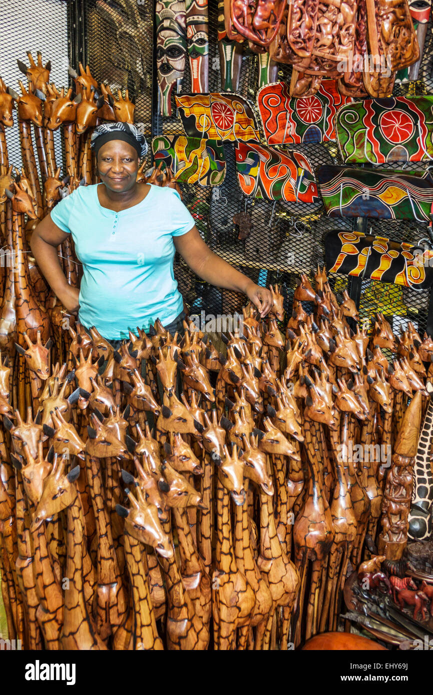 Johannesburg South Africa African Rosebank Mall The Flea Market Shopping Sale Display Arts Crafts Vendor Stall Black Woman Wood Sculptures Gir Johannesburg South Africa African Rosebank Mall The Flea Market Shopping Sale Display Arts Crafts Vendor Stall Black Woman Wood Sculptures Gir