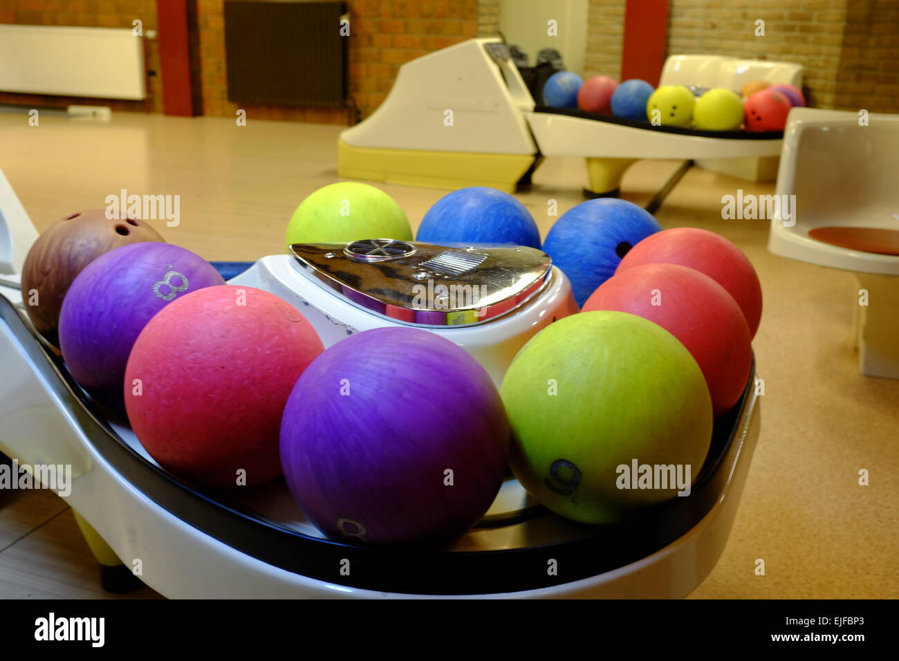 Bowling Balls in the ball return at the Bowling Alley Stock Photo