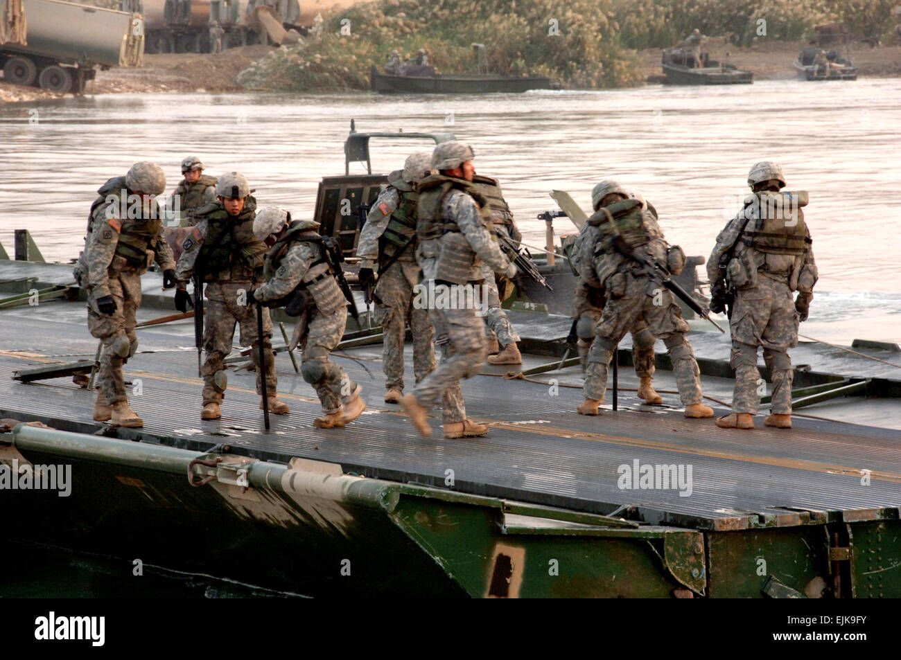 U.S. Army Soldiers from the 20th Engineer Brigade build a bridge Stock