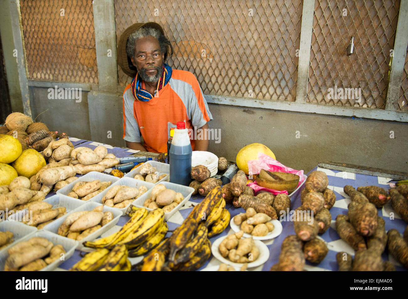 Man selling produce at the market, NieuwNickerie, Suriname Stock Photo