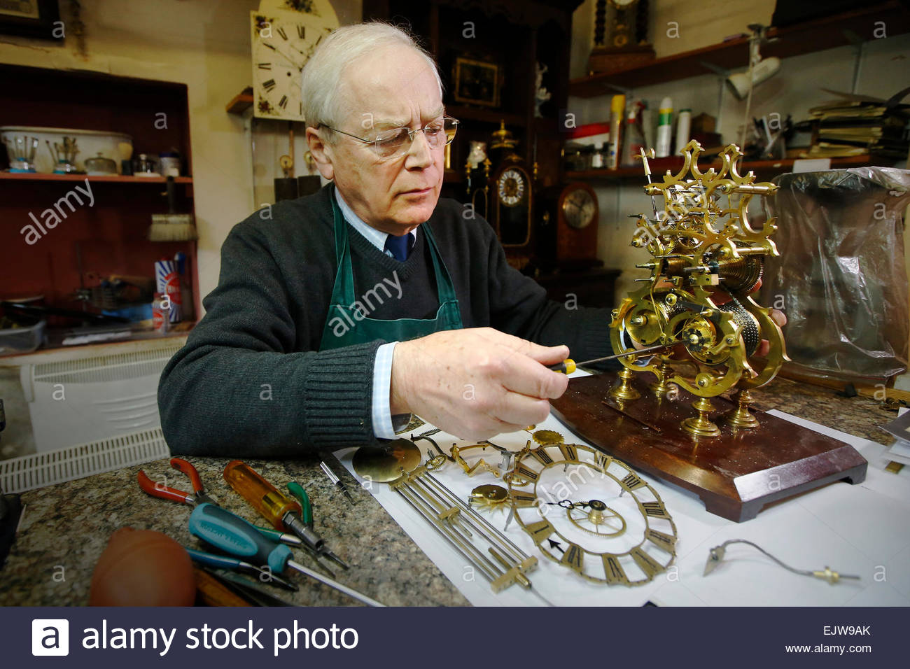 Antique clock restorer William Tyrrell works on an antique 'skeleton