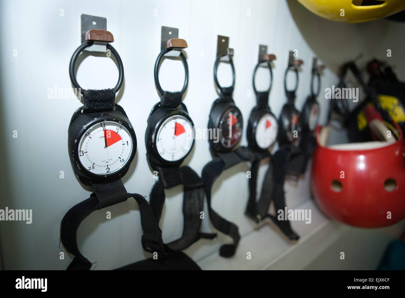 Several altimeters used for skydiving ready to use, amd helmets Stock